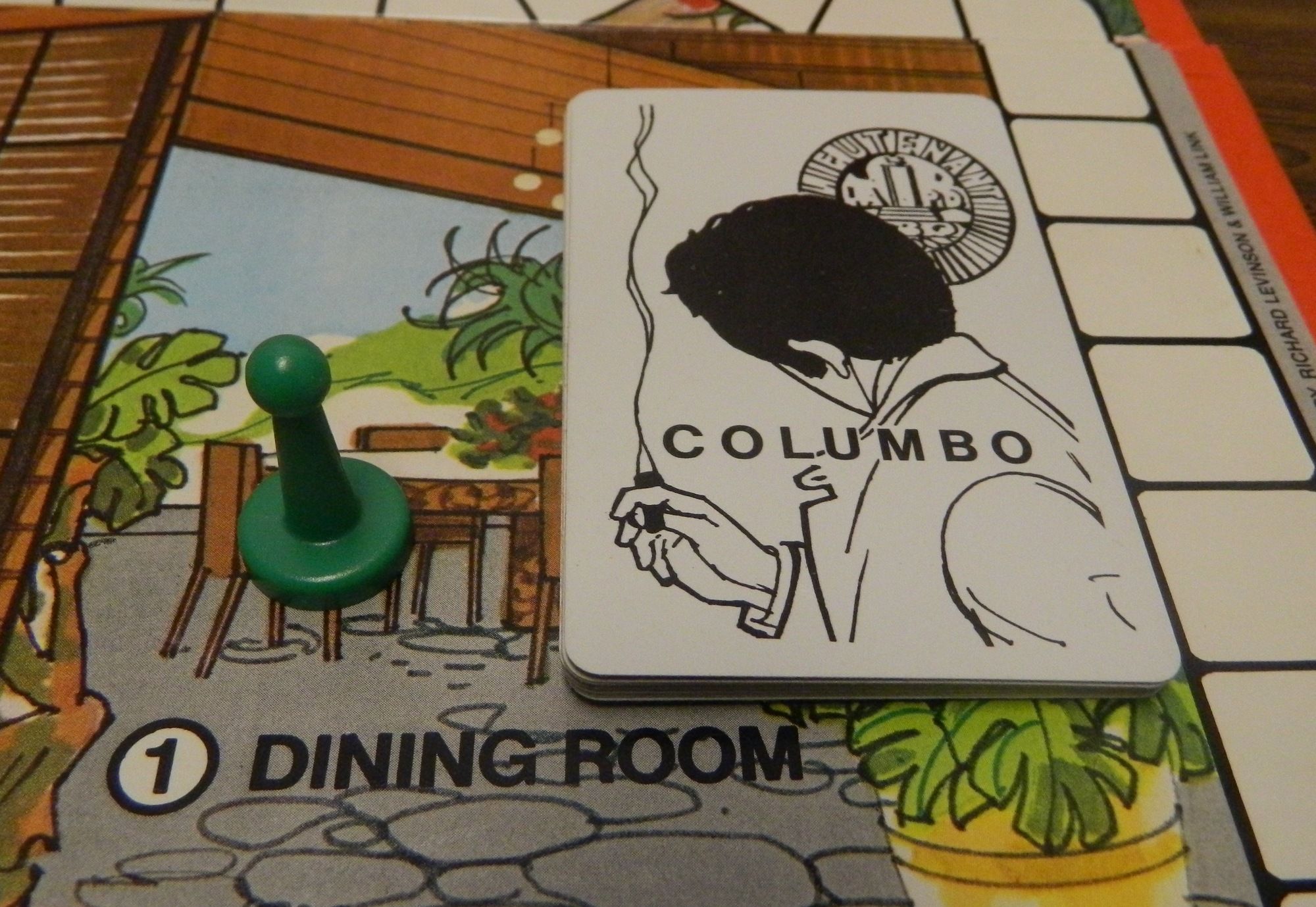 A picture of the Columbo board game, created in 1973. Shows the draw card mechanism, and the dining room area.