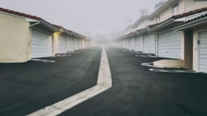 A row of garage doors leading out to Santa Barbara fog.