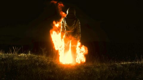 A man in a spacesuit walking in fire? I don't know.